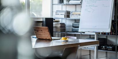 Desk with a computer and coffee 